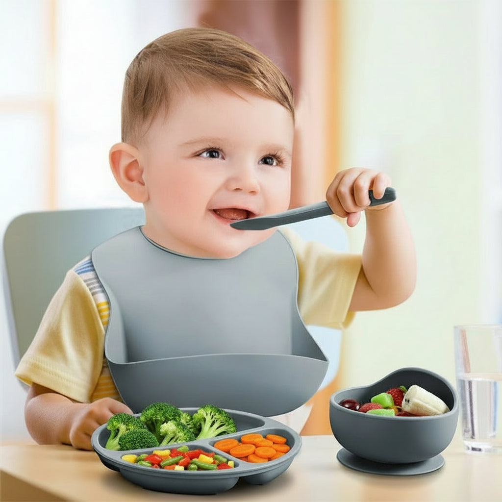 Baby eating with a bowl and spoon, wearing a bib, with text in the background