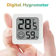 Digital hygrometer displaying temperature and humidity with a smiley face icon, held by hands.